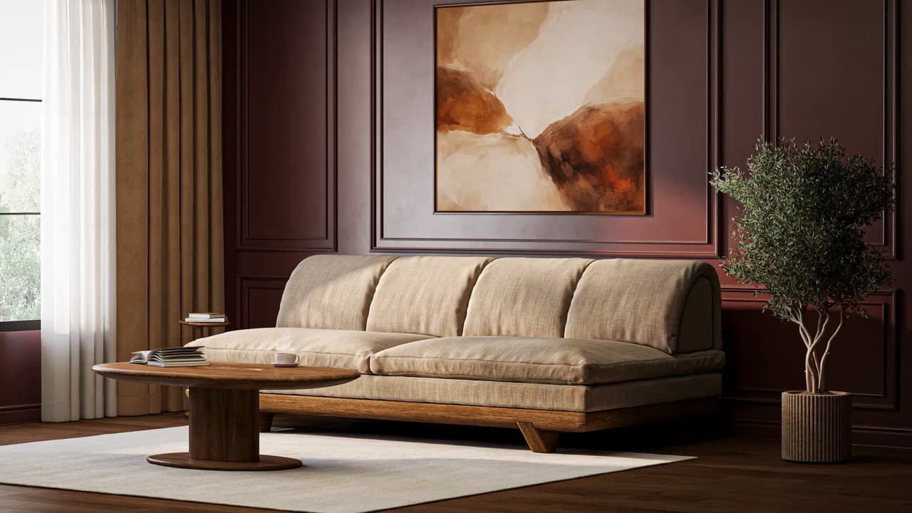 CGI interior visualization of a modern beige modular sofa and wooden table against a dark red wall, featuring warm sunlight and abstract art.