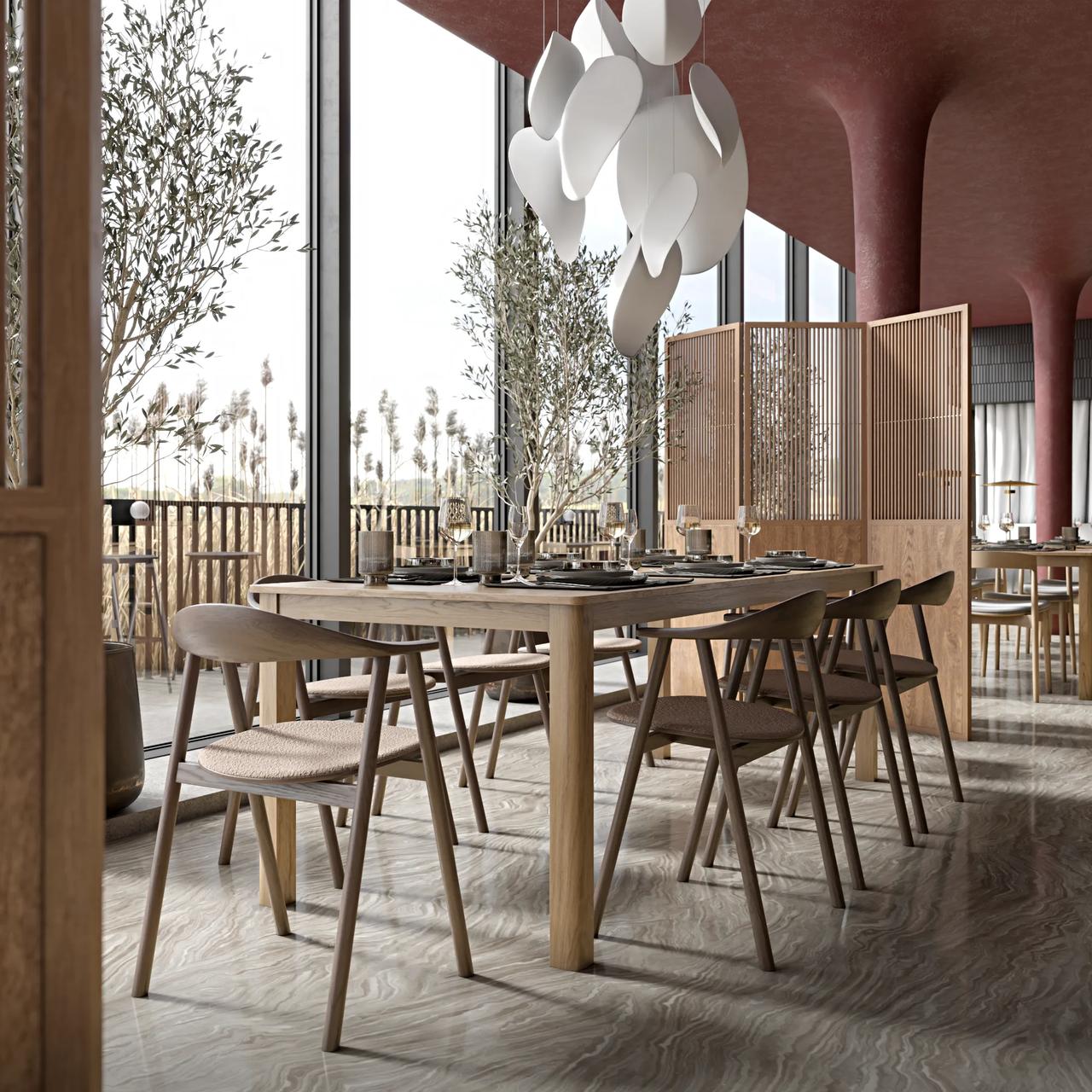 Scandinavian style restaurant interior featuring a natural wooden dining table, chairs with woven seats, a sculpted white pendant light, and floor-to-ceiling windows looking out onto a terrace