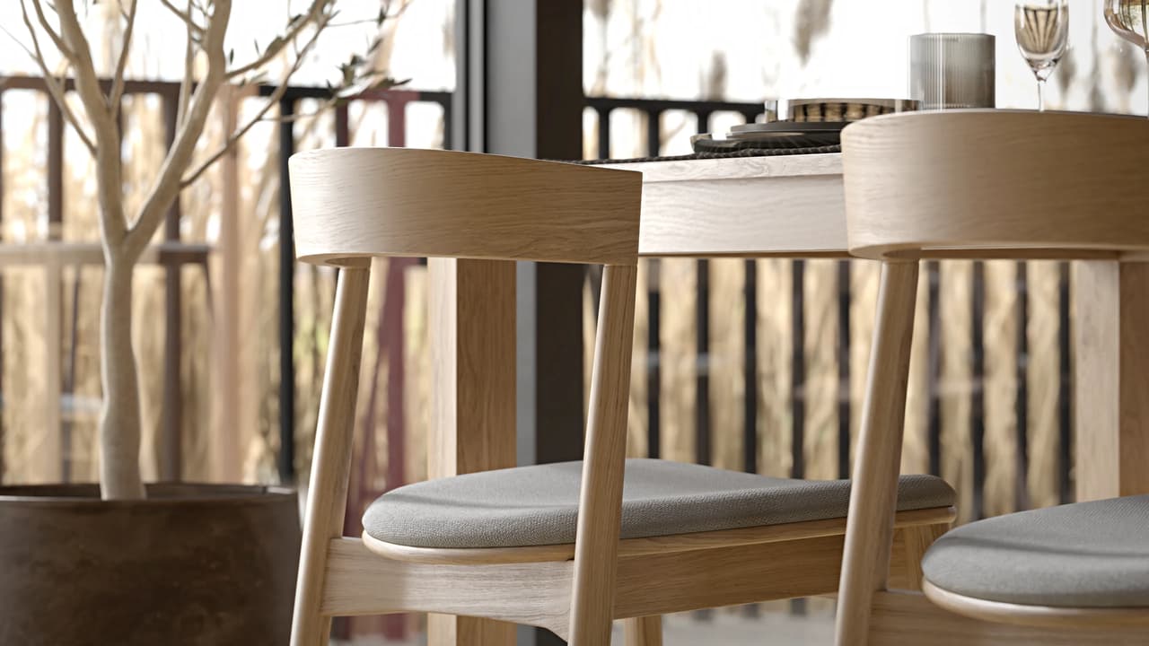 Detailed close-up of a light oak dining 3D chair and the edge of a matching 3d table model, showcasing photorealistic wood grain. 