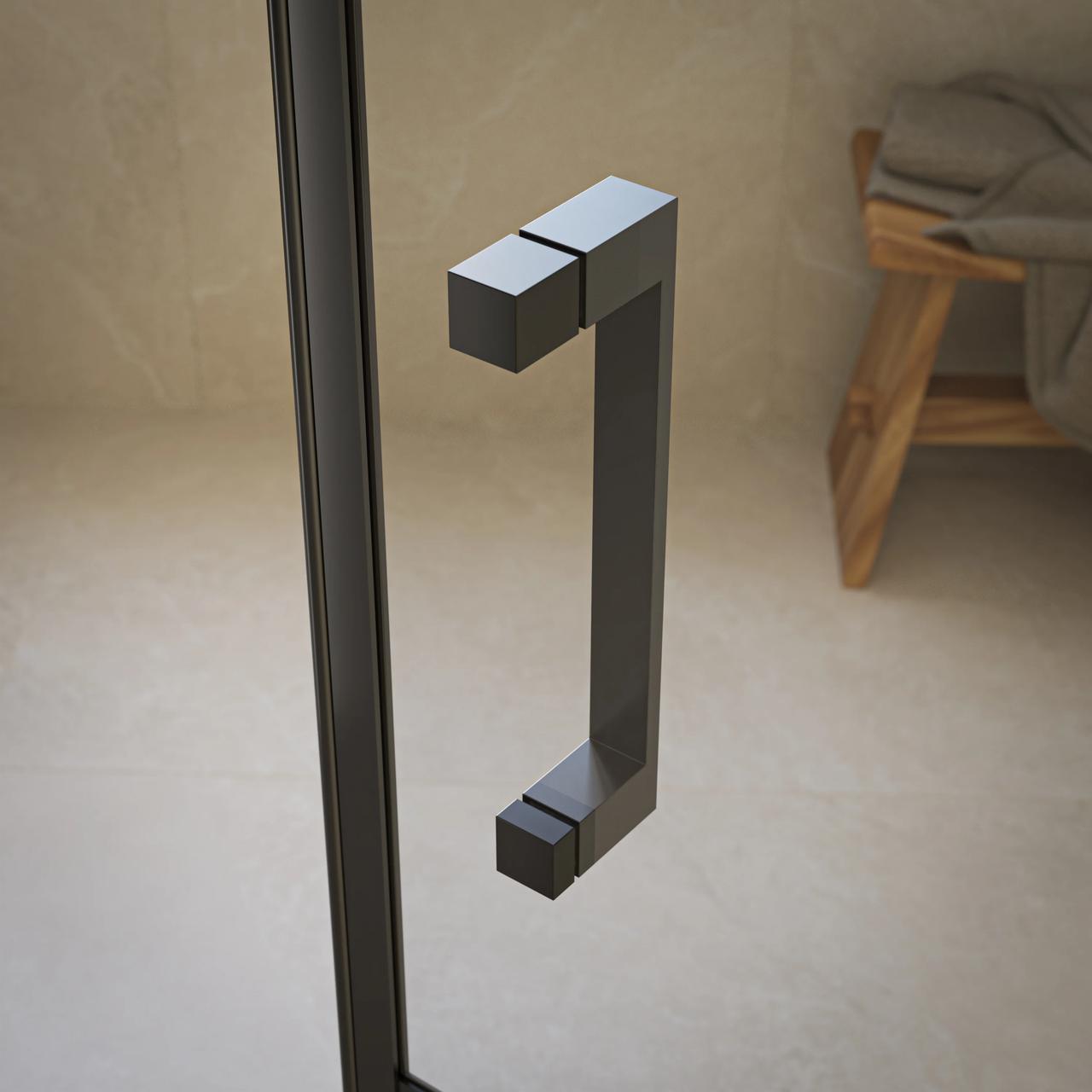 Close-up shot of a modern matte black rectangular handle mounted on a clear glass shower door with a blurred bathroom background