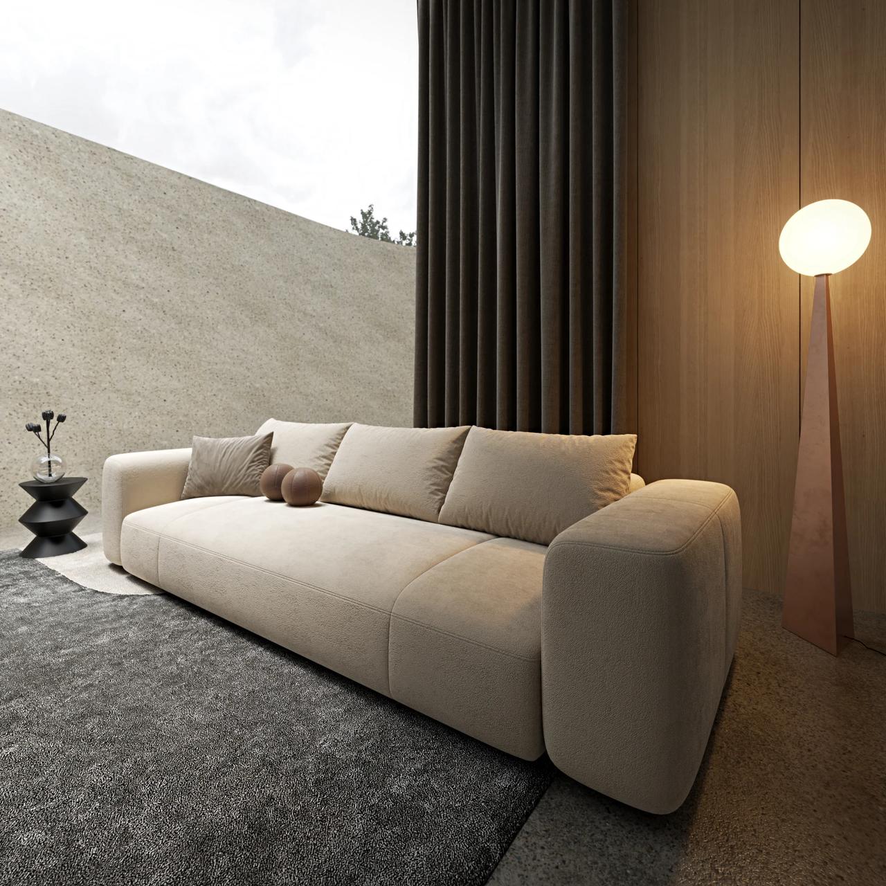 Minimalist living room featuring a low-profile beige fabric sofa on a textured dark grey rug, ambient wooden wall panels, dark floor-to-ceiling curtains, and a glowing sculptural floor lamp