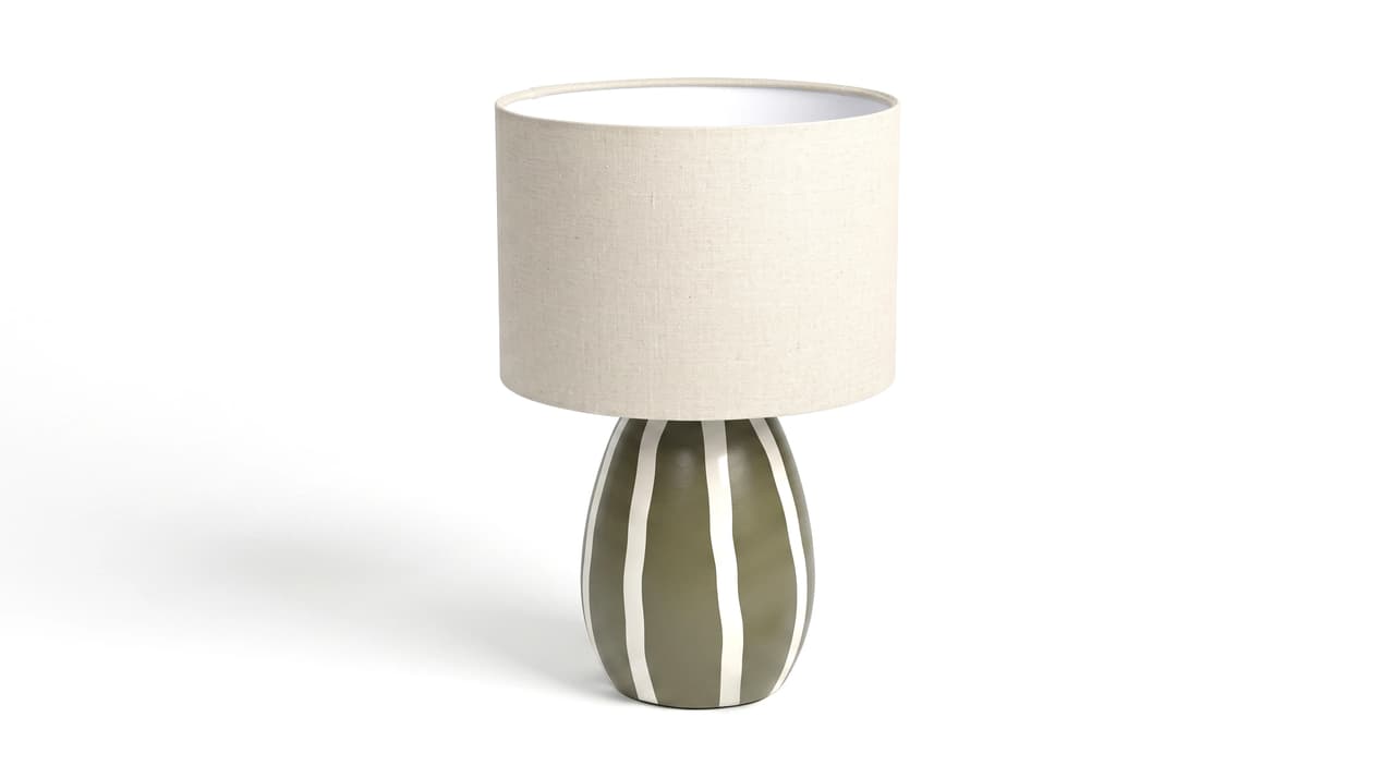 Front view studio render of a ceramic table lamp with green striped base and fabric shade
