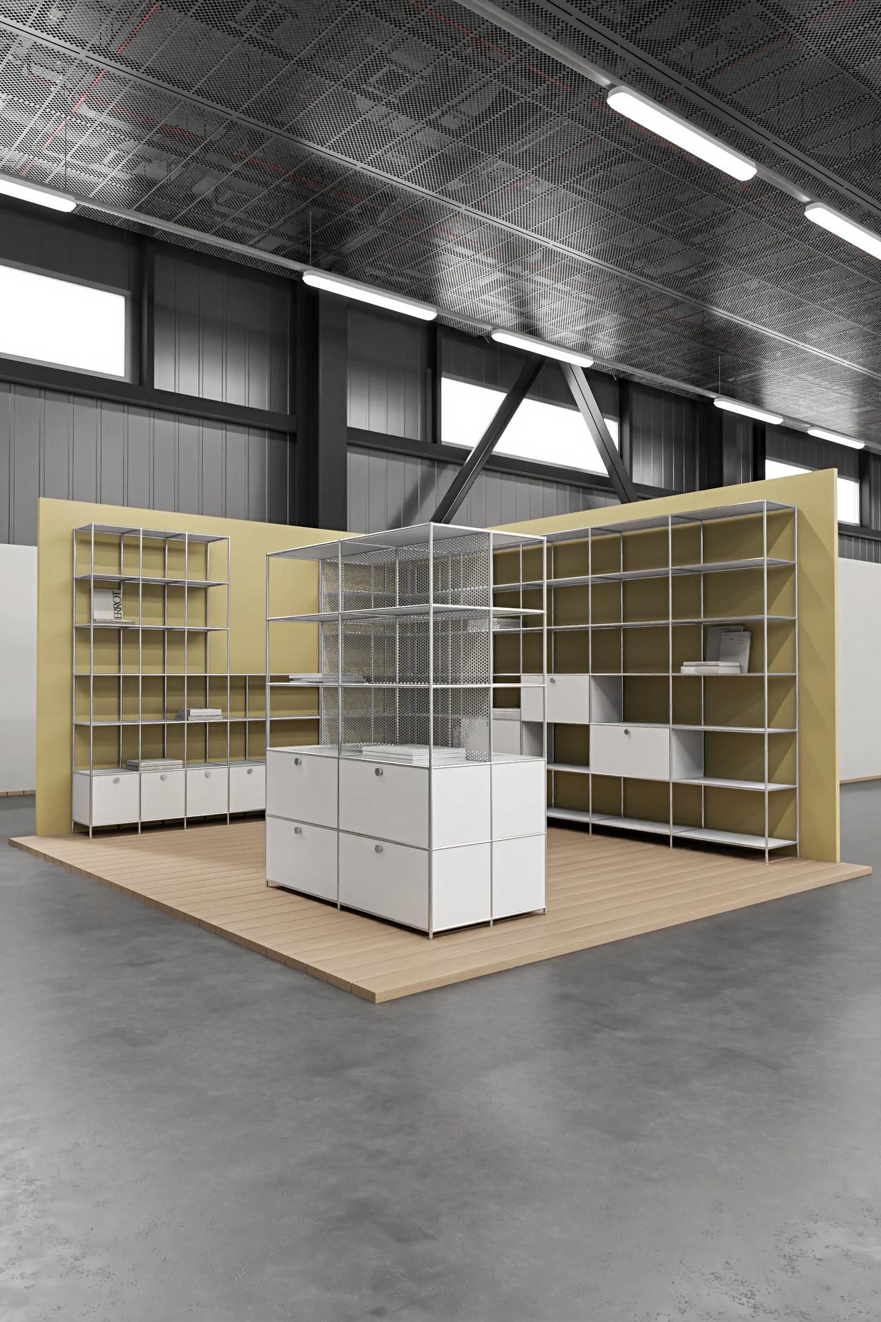 A large industrial showroom featuring versatile 3d cabinet design, where white office modular furniture forms a complete commercial display booth against yellow backdrops.
