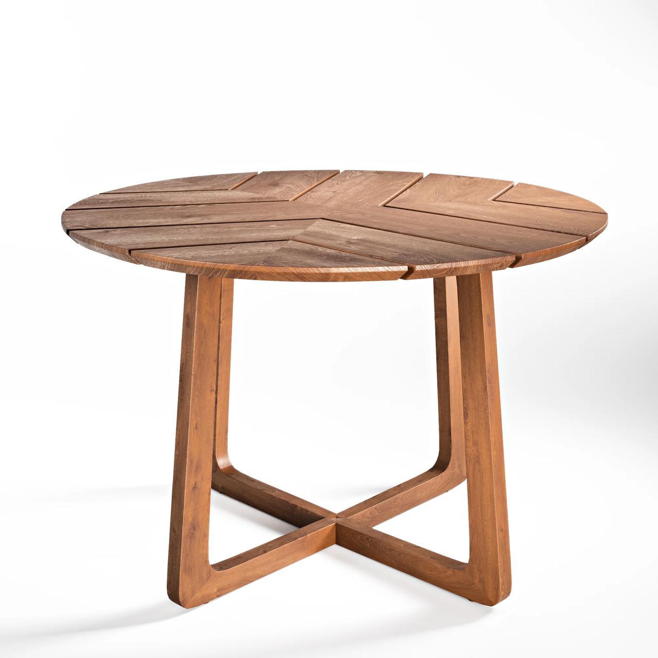 Three-quarter view silo render of a round teak table showing slatted tabletop pattern