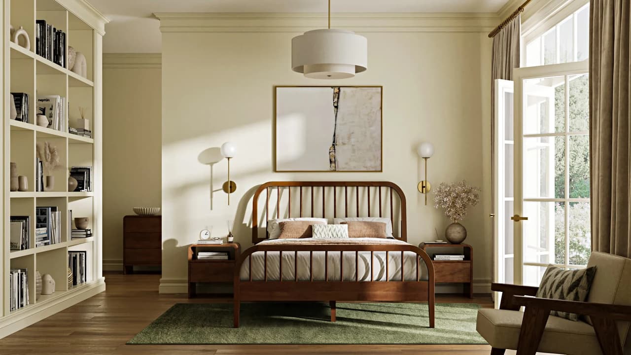 A sunlit 3d bedroom interior centered around a wooden spindle bed with white bedding and brown pillows, resting on a green rug. Flanking the bed are matching wooden nightstands with brass wall sconces, below a large abstract painting. To the left is a tall, built-in white bookshelf filled with books and decor, and to the right, a glass door with beige curtains and a wooden armchair in the foreground.