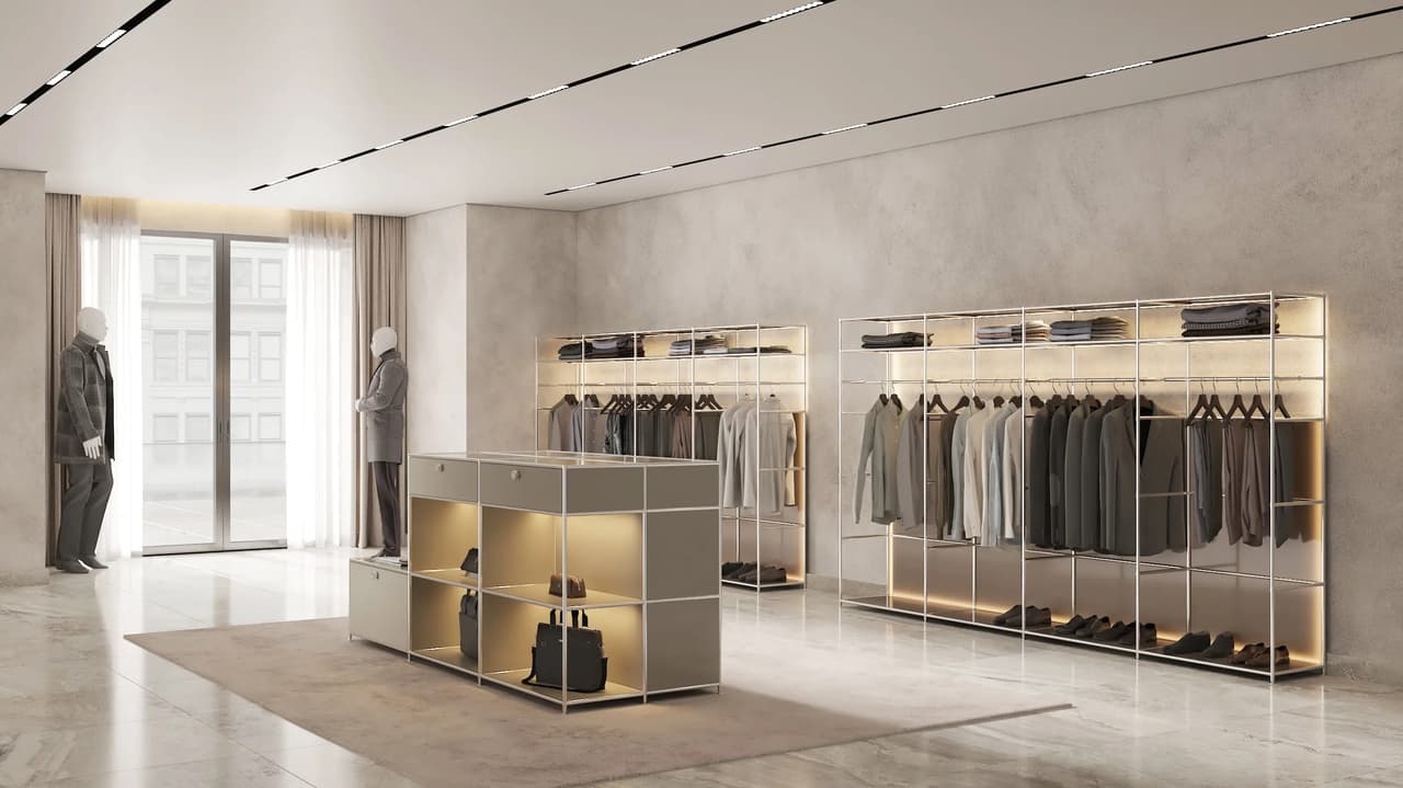 A bright, minimalist clothing store interior featuring custom 3d cabinet structures with integrated LED lighting for displaying garments and accessories.