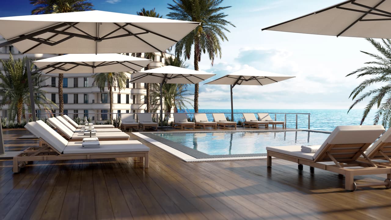 A luxurious resort pool deck featuring rows of wooden sun loungers and large white cantilever umbrellas overlooking the ocean, demonstrating photorealistic outdoor furniture 3d rendering.