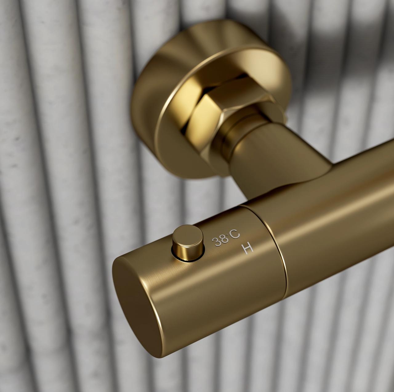High-precision 3D product rendering close-up of a brushed brass shower mixer control with temperature markings.