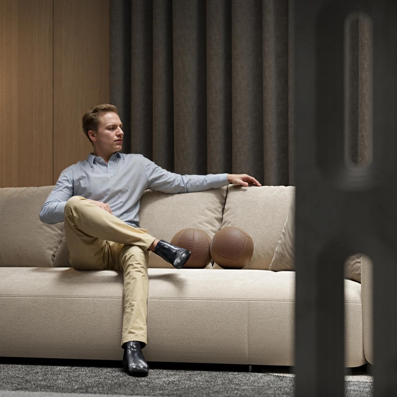 A lifestyle 3D interior rendering featuring an AI-generated man sitting on a modern beige sofa, demonstrating seamless AI human integration in furniture CGI.