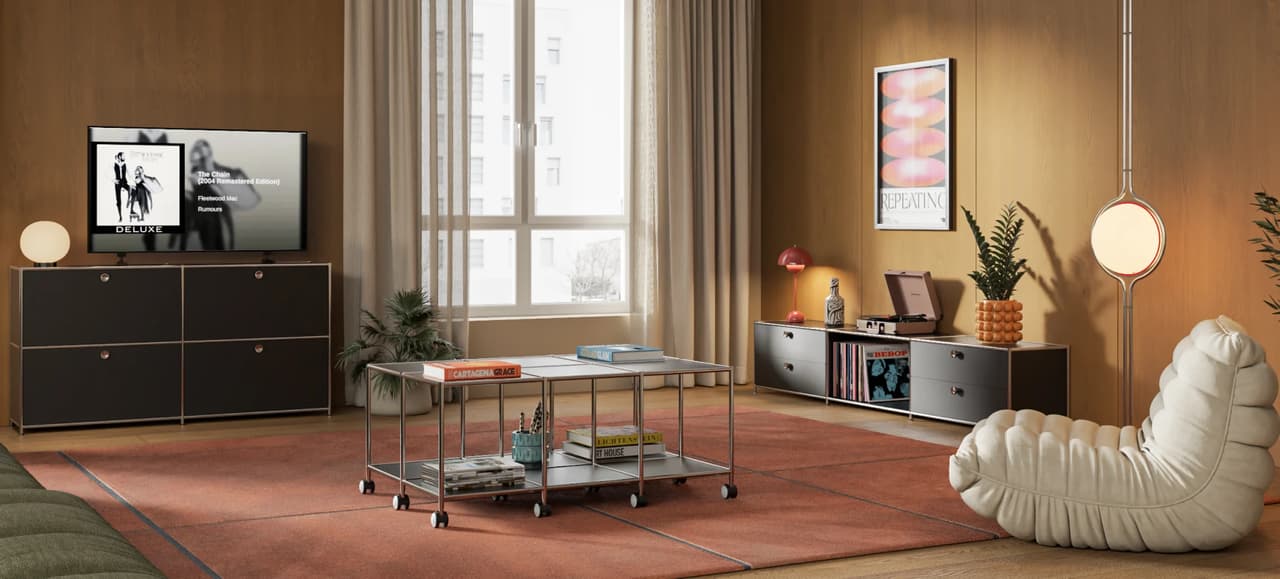 Interior render of a warm, modern living room featuring a white tufted lounge chair, black modular 3D cabinets, and a terracotta rug.