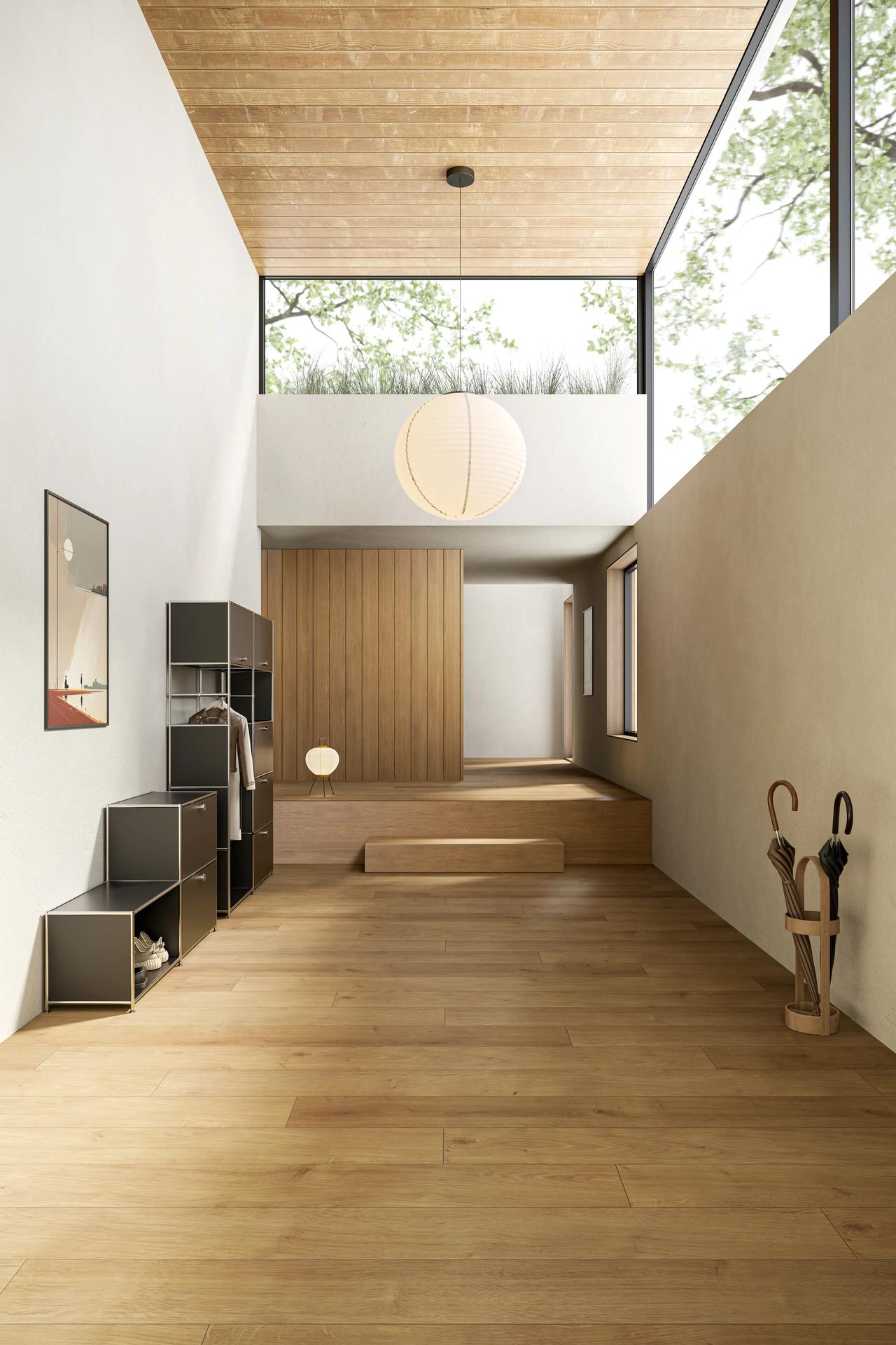 A bright, minimalist home hallway with wooden floors, featuring a creative 3d cabinet design used for shoe and coat storage.