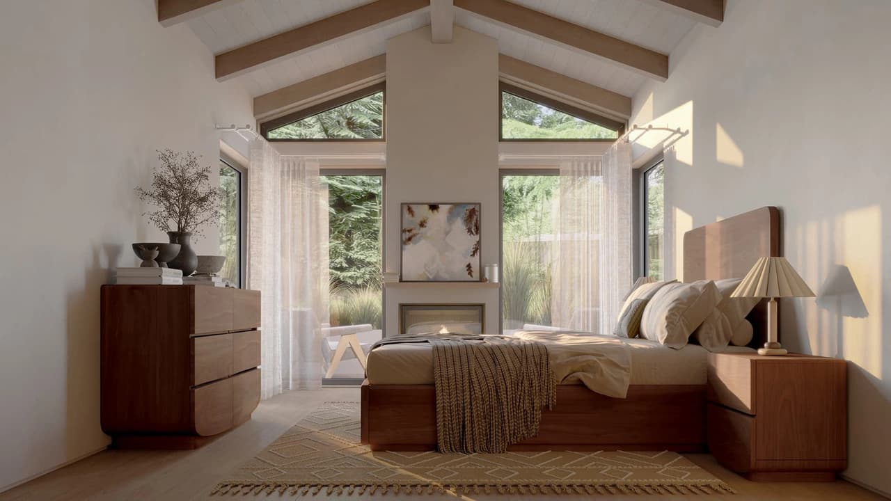A sunlit cgi bedroom in a modern cabin with a vaulted ceiling and exposed wooden beams. A central fireplace with an abstract painting above it sits between large windows revealing a pine forest. The room is furnished with a wooden bed covered in soft linens and a fringed throw blanket, a matching nightstand with a pleated lamp, and a curved wooden dresser on the left. Warm natural light casts soft shadows across the patterned rug and light wood floor.